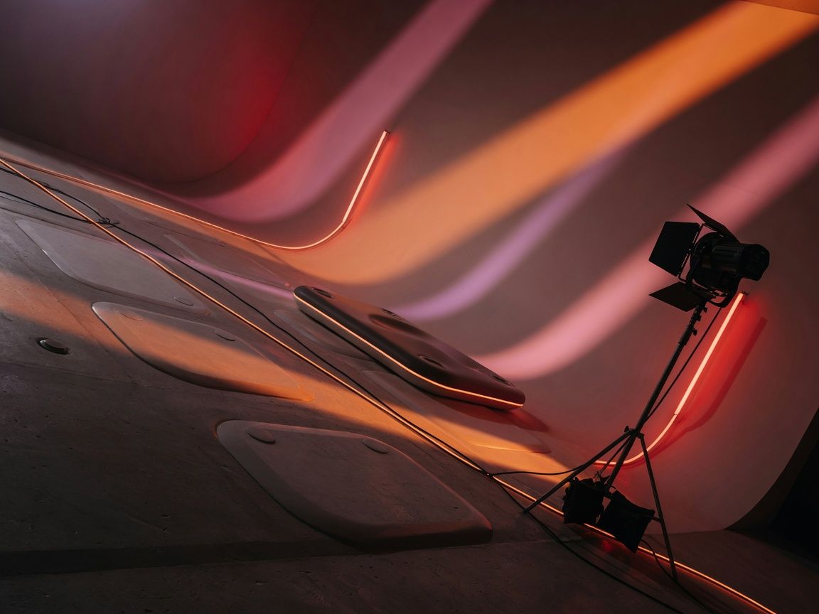 Cyclorama studio with seamless white curved walls and concrete floor